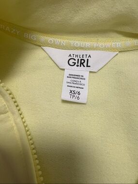 Athleta Girl Lightweight Zip-Up Jacket in Pale Yellow with matching bike shorts